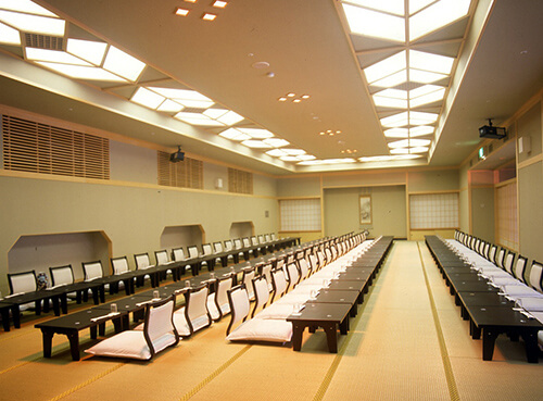 The Shiki hall, a tatami room set with long low tables and legless chairs